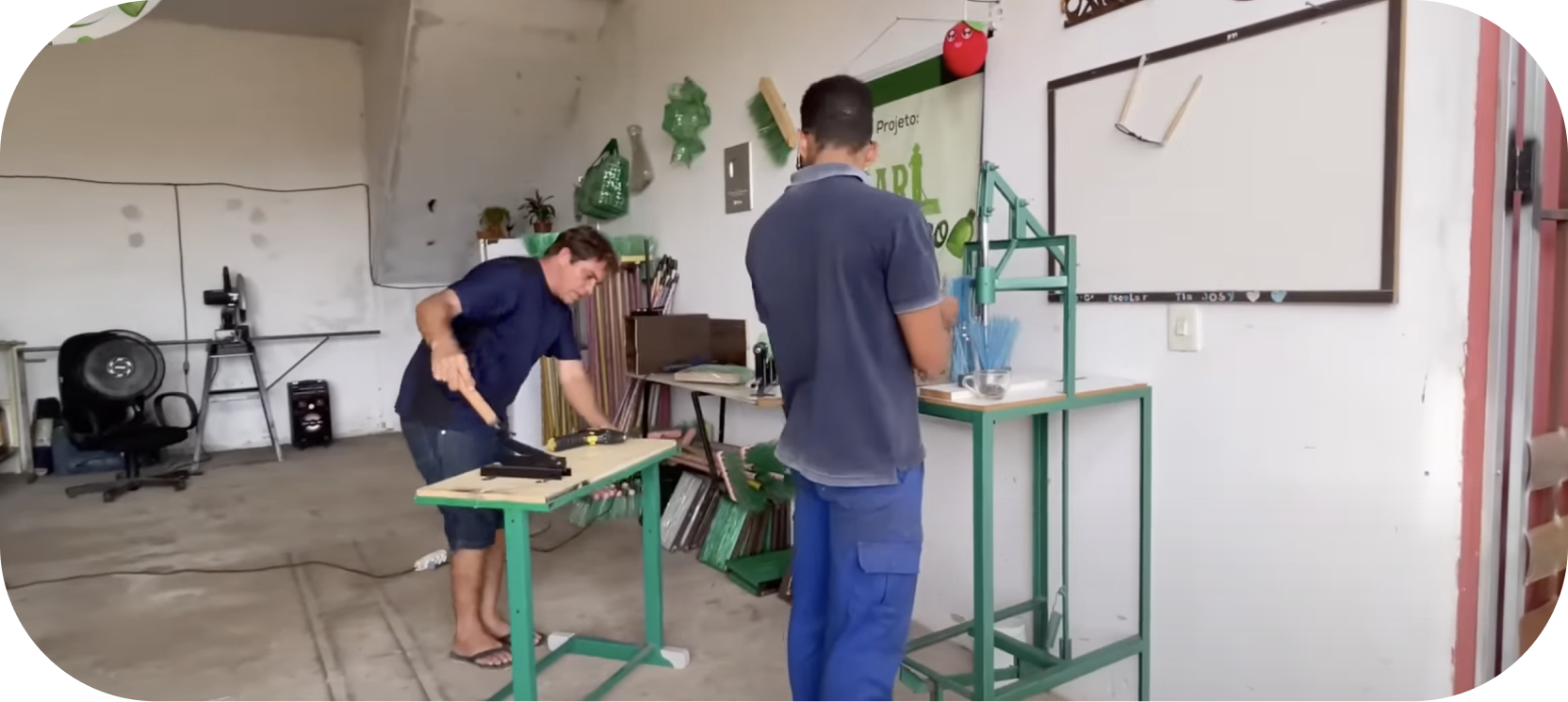 giorggio_abrantes's work shop where he recycles plastic bottles into useful brooms which is an eco-friendly business idea!