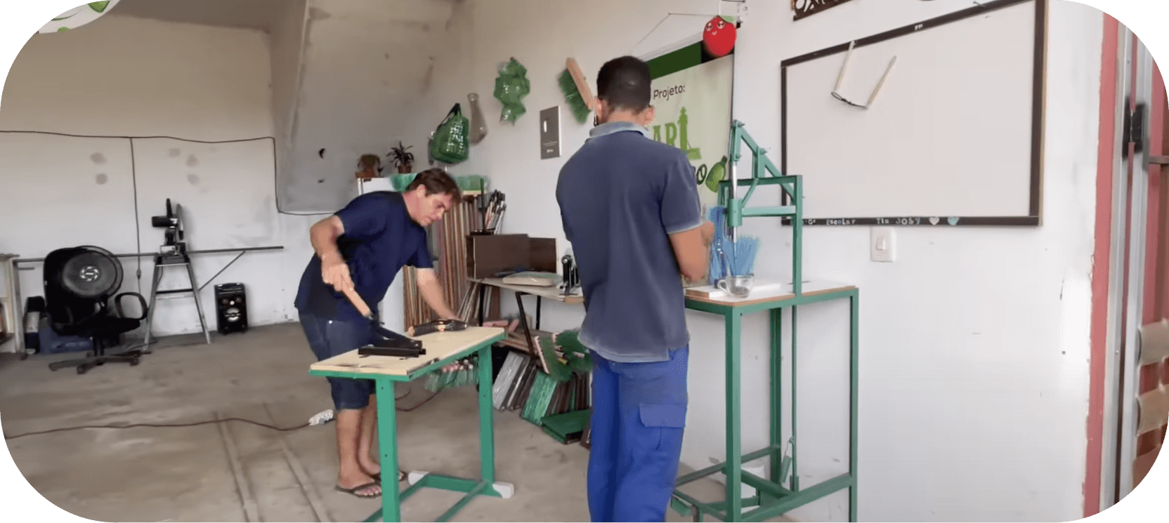 giorggio_abrantes's work shop where he recycles plastic bottles into useful brooms which is an eco-friendly business idea!